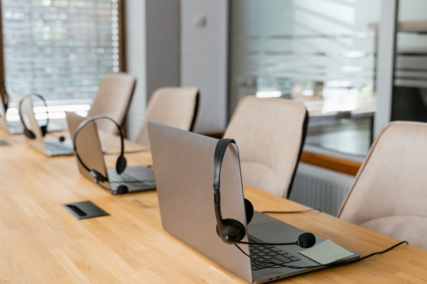 Technical support workstations with headsets ready for the next call